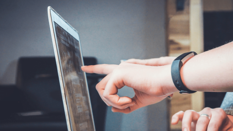 pointing at monitor